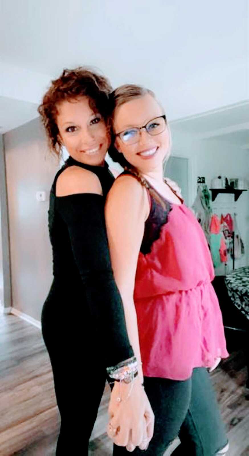 Two mom and co-parents take a cute selfie together, both dressed up for a girls' night out