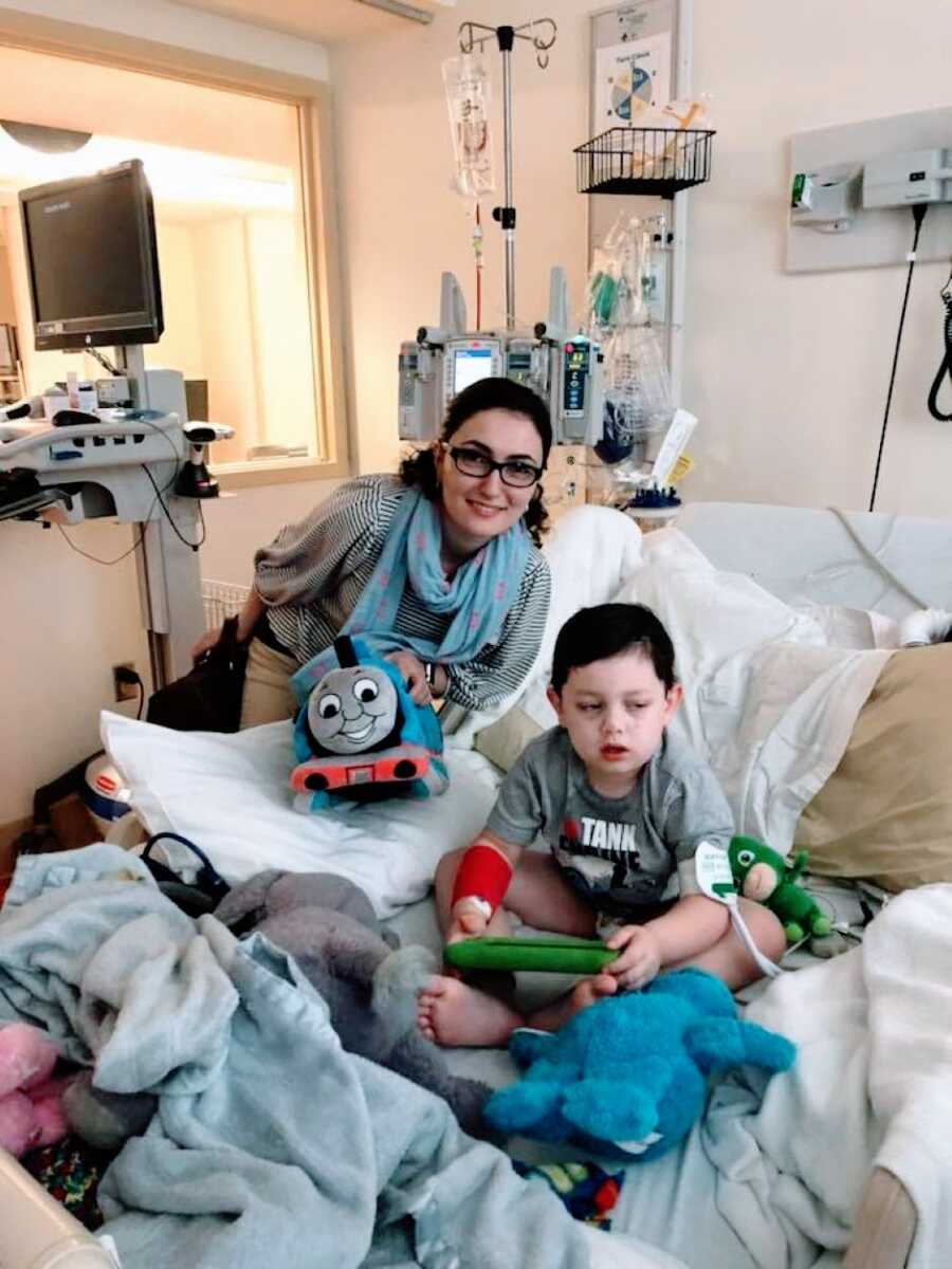 Special needs mom takes a photo with her son in the hospital while he receives an EEG to see why he's having seizures