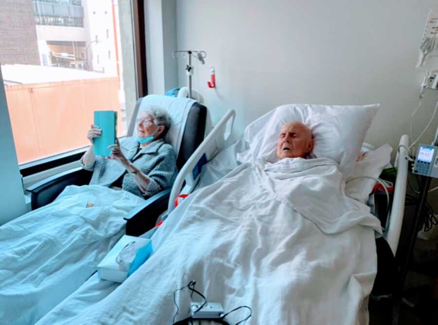 Elderly couple enjoying their final days together lay next to each other in the hospital