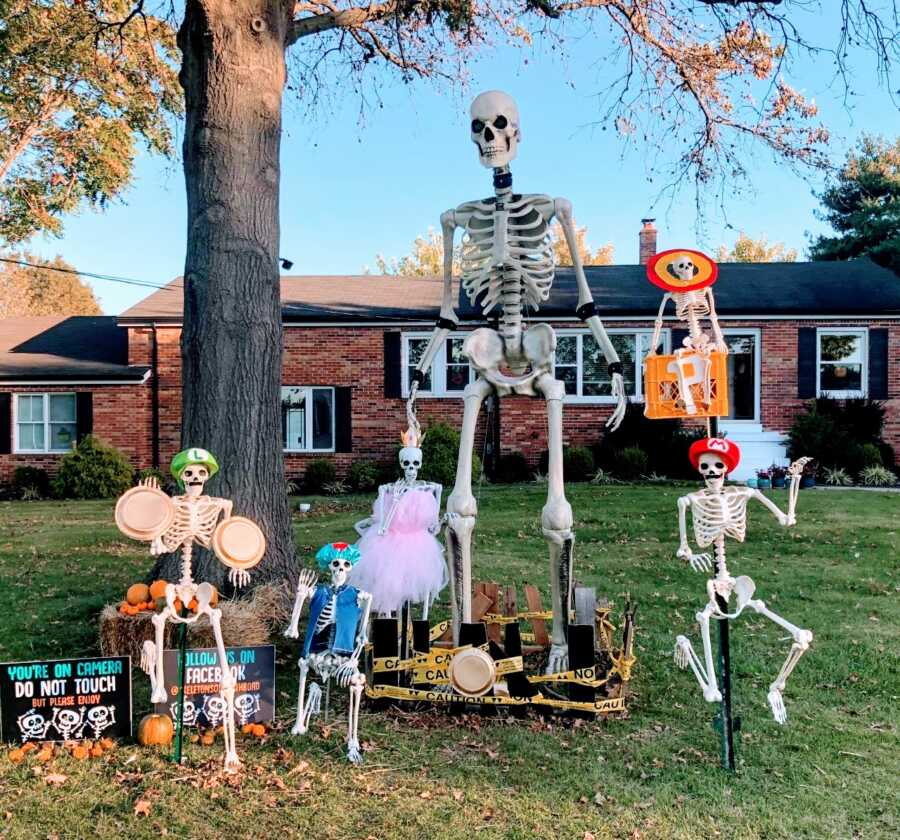 Couple celebrating Halloween with daily skeleton yard displays dress them up as characters from the Super Mario Brothers