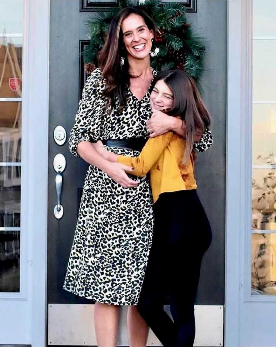 Girl mom hugs her oldest daughter after finding out about her act of kindness at school that day