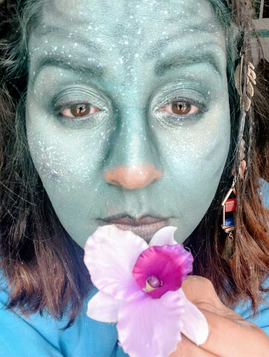 Mom takes a selfie showing off her incredible makeup skills for a DIY Halloween costume as an avatar