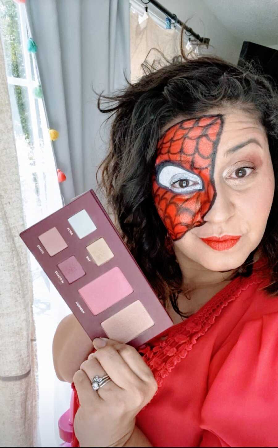 Mom takes a selfie of her impressive makeup Spiderman mask for a Halloween Costume