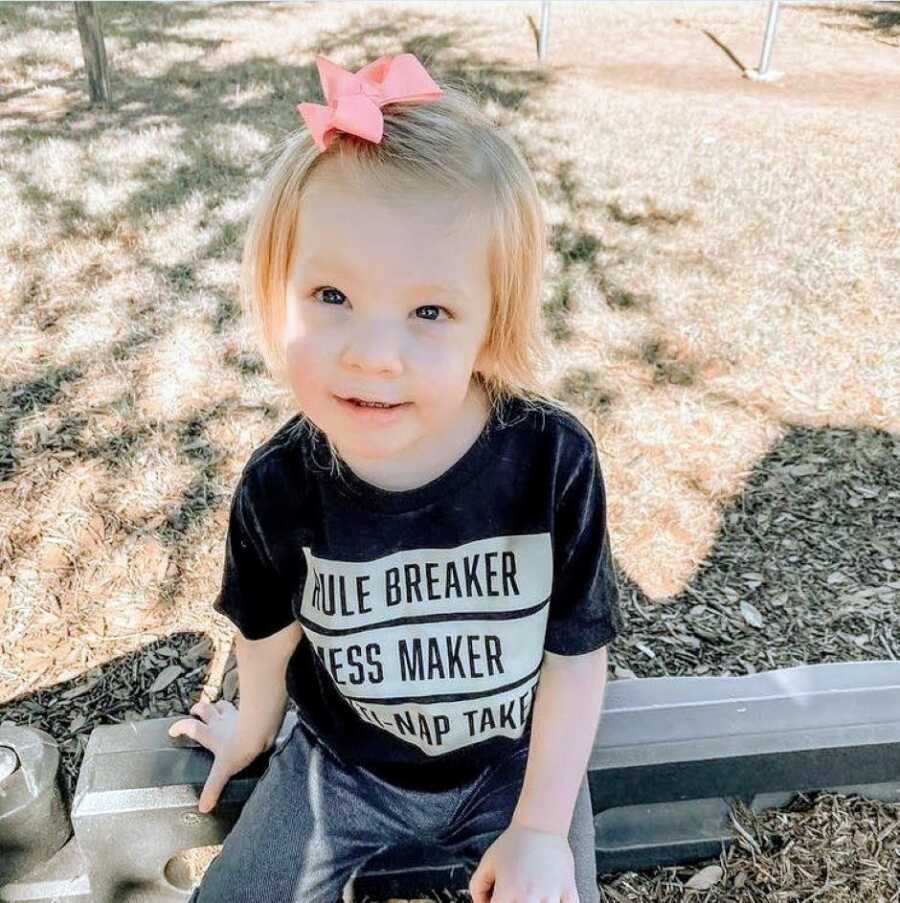 Mom snaps a photo of her daughter with rare Coffin-Siris Syndrome playing at the park