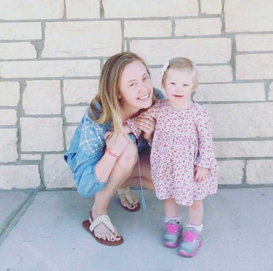 Mom and daughter take a photo together before church on a Sunday morning