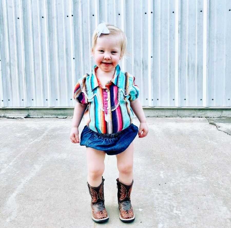 Little girl with Coffin-Siris Syndrome smiles big during a county fair event