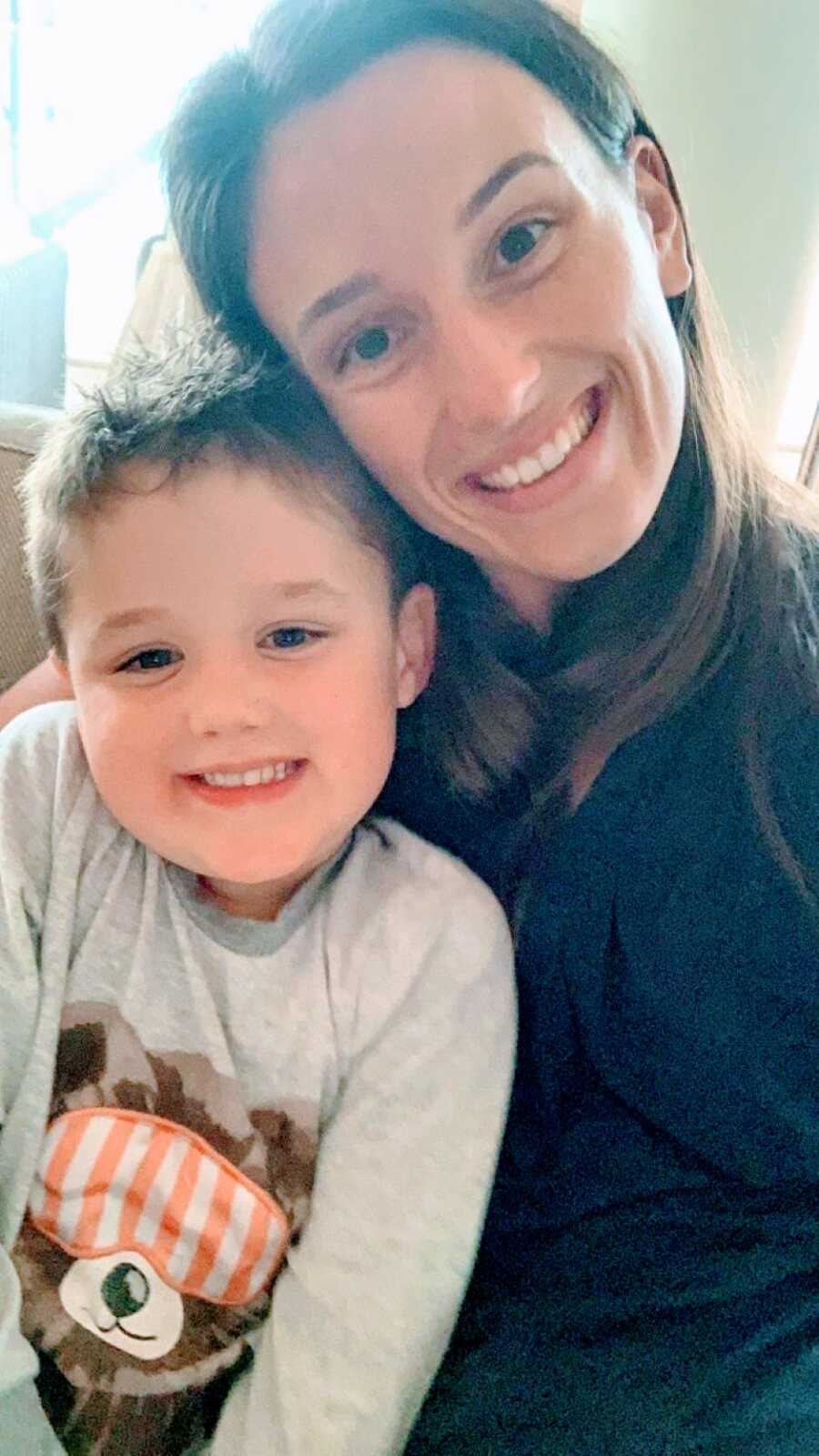 Woman who gained sole custody of her son takes a photo with him to celebrate moving and starting a new life