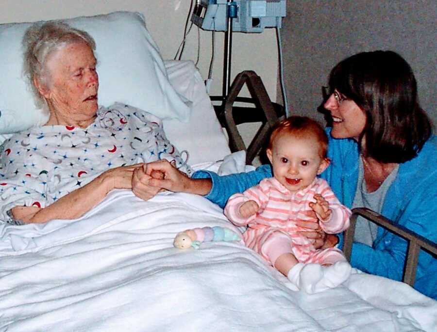 mom and daughter visiting grandma with alzheimers at the hospital