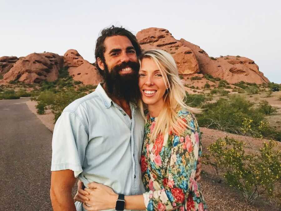 woman and man out together near the mountains