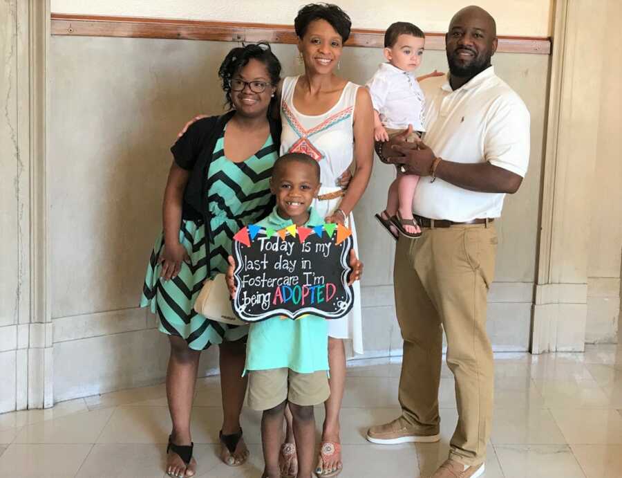 The Taylor's pose for a family picture on Dwayne's adoption day. 