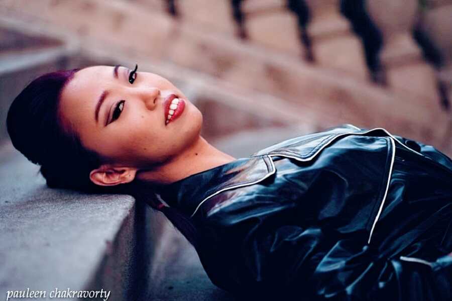 Woman with cerebral palsy modeling on steps