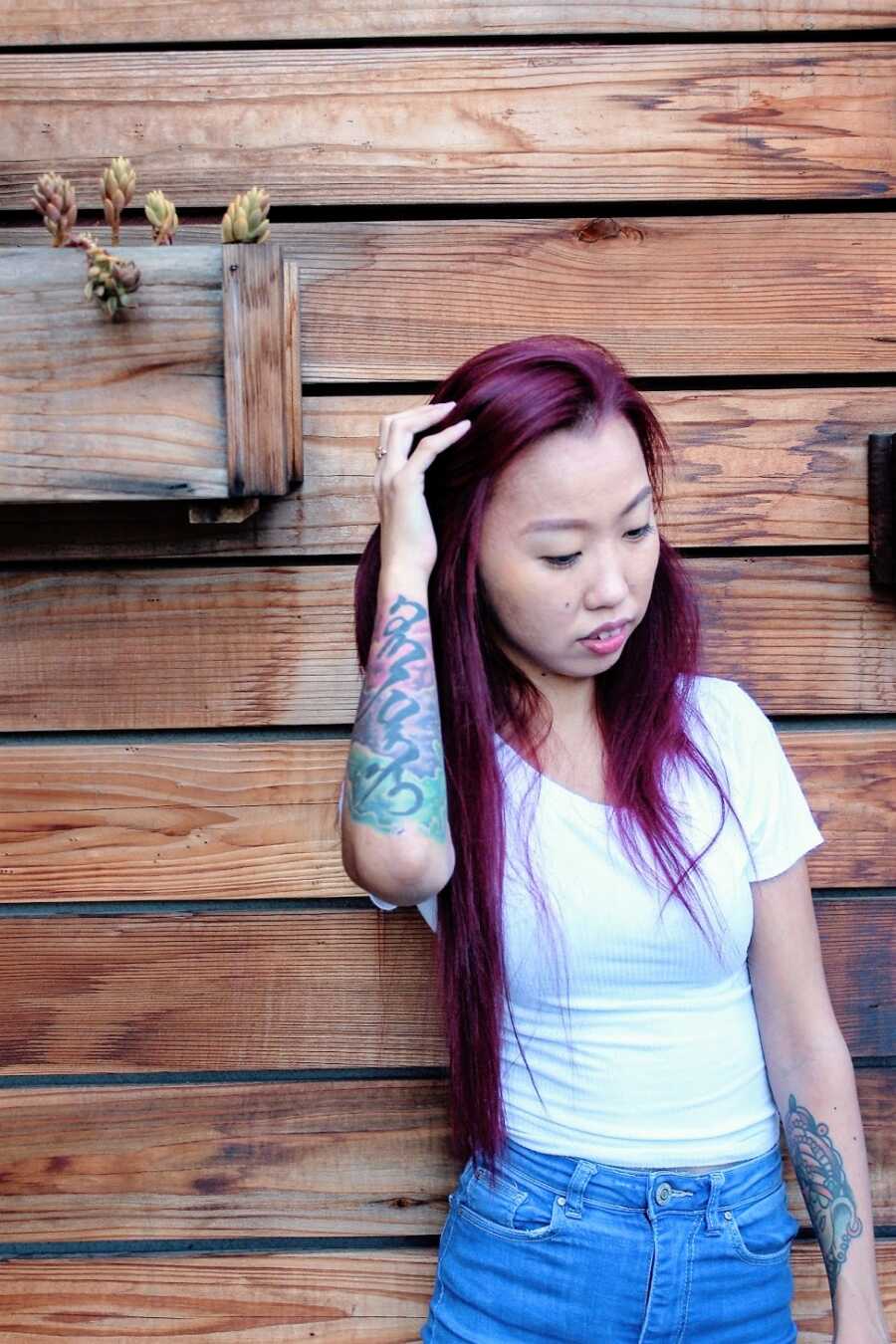 Woman with cerebral palsy wearing white shirt