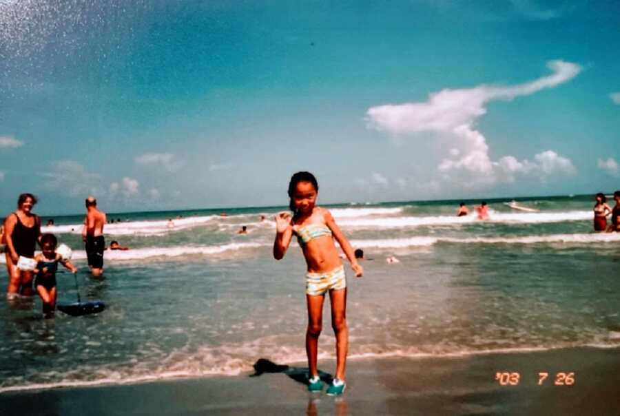 Little girl with cerebral palsy on the beach