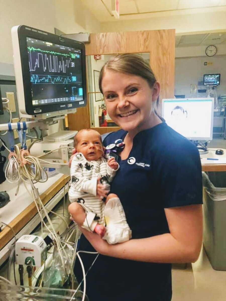 NICU nurse holds newborn baby boy