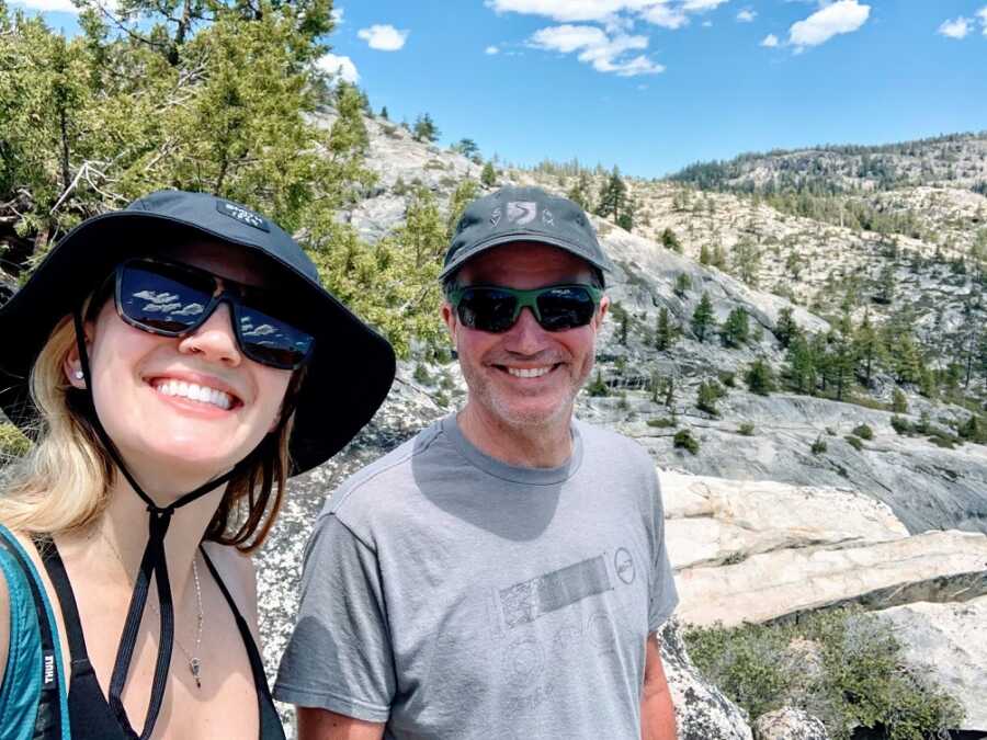 Sober woman and her father in the mountains