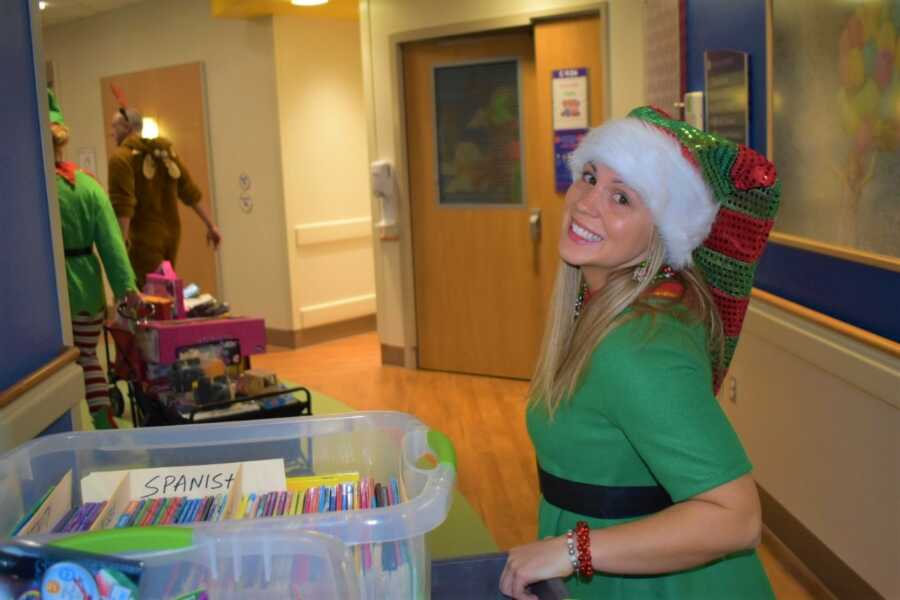 Loren Jewell and fellow firefighters deliver coloring books to kids in local children's hospital.