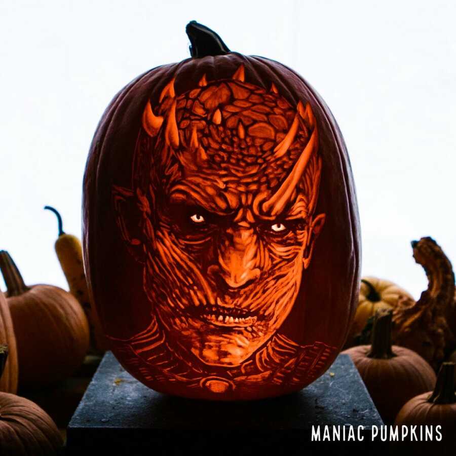 Detailed pumpkin carving of Darth Maul, created by Maniac Pumpkin Carvers. 