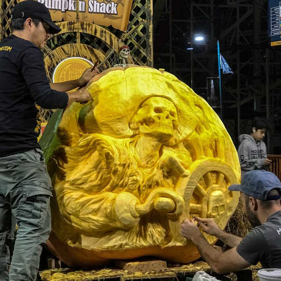 Giant pumpkin sculpting of a skeleton pirate, created by Maniac Pumpkin Carvers. 