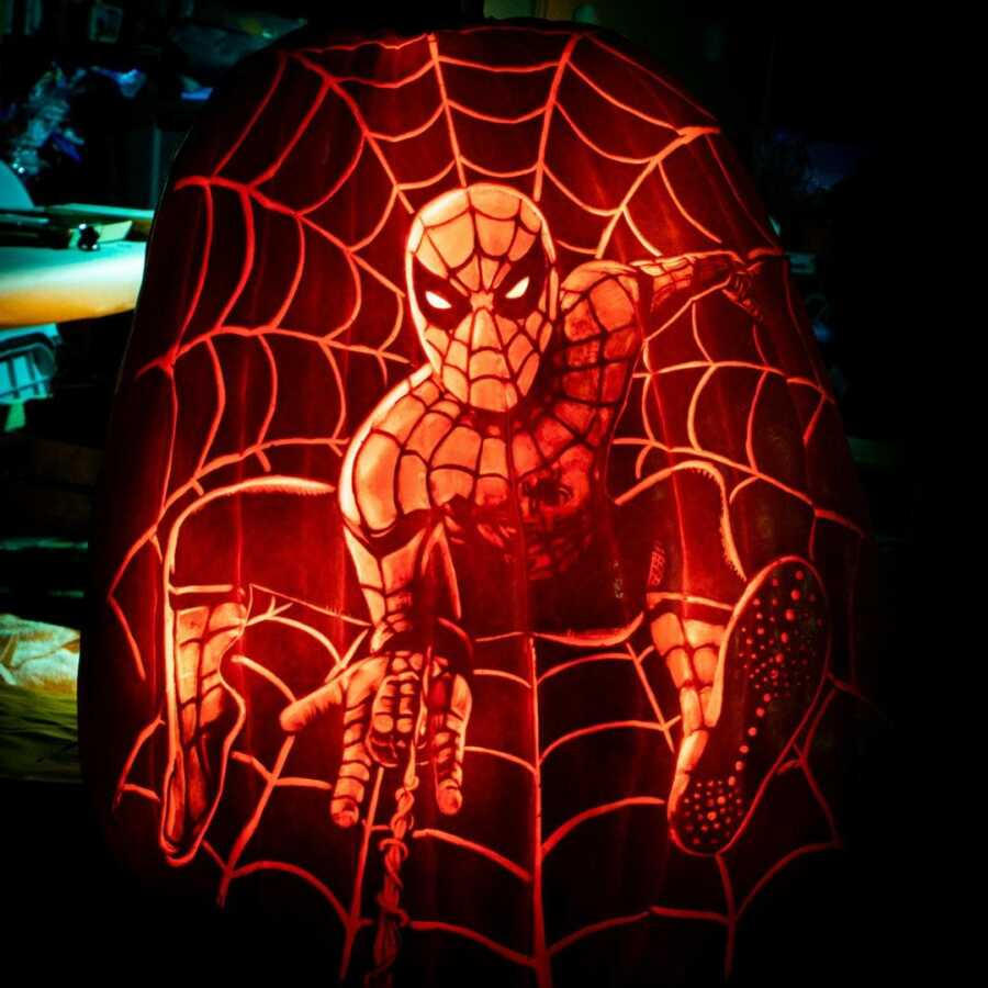 Detailed Spiderman pumpkin carving, created by Maniac Pumpkin Carvers.