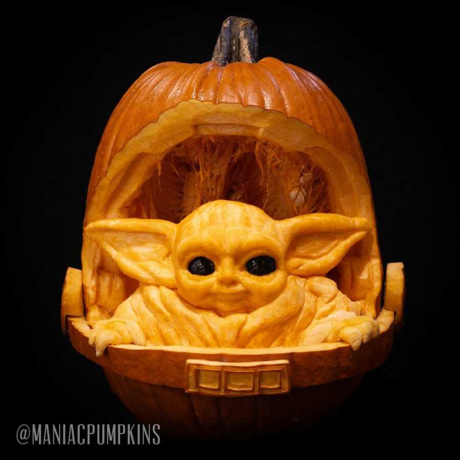 Pumpkin sculpture of The Child, created by Maniac Pumpkin Carvers. 