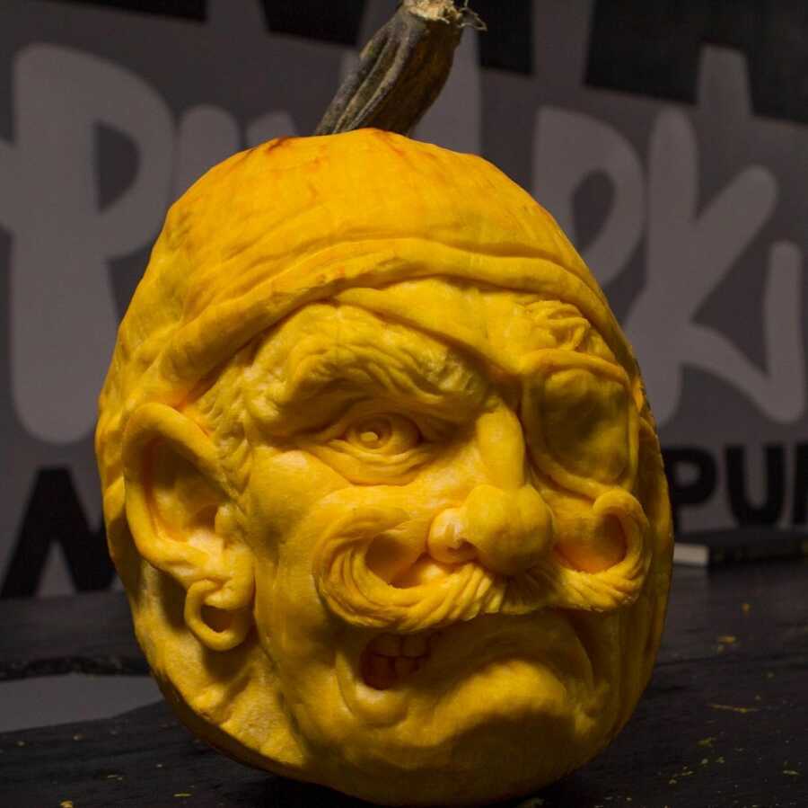 Pumpkin sculpture of pirate face, created by Maniac Pumpkin Carvers. 