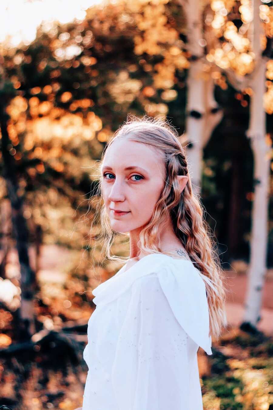 A woman with anorexia standing outdoors