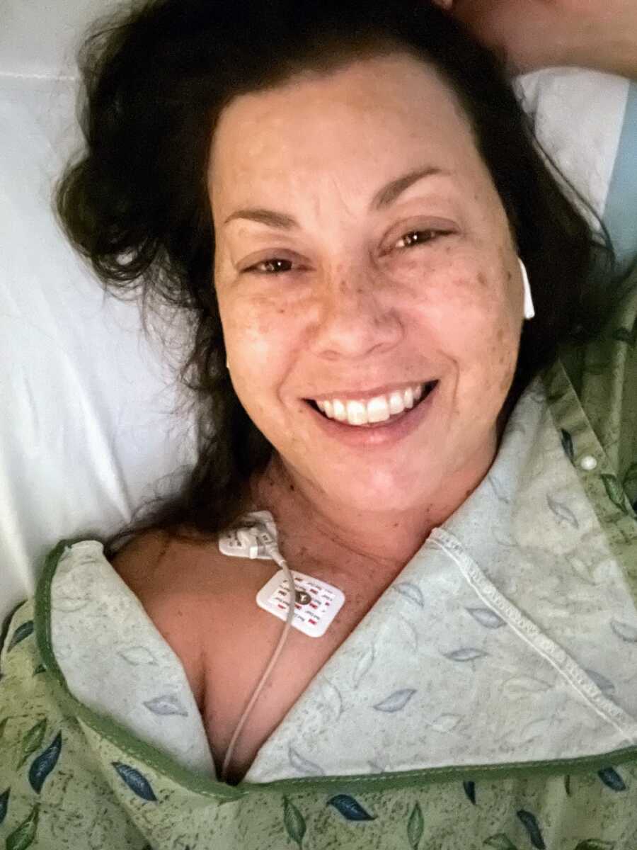 woman at the ER smiling while taking a selfie