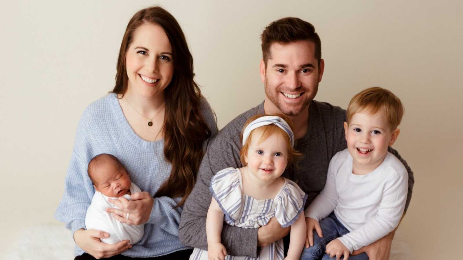 Family of five with adopted baby boy