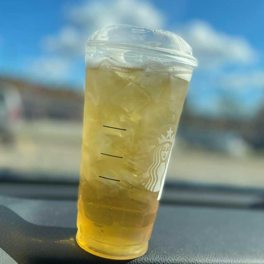 mom's iced tea from starbucks that she drinks in the parking lot to catch a breather