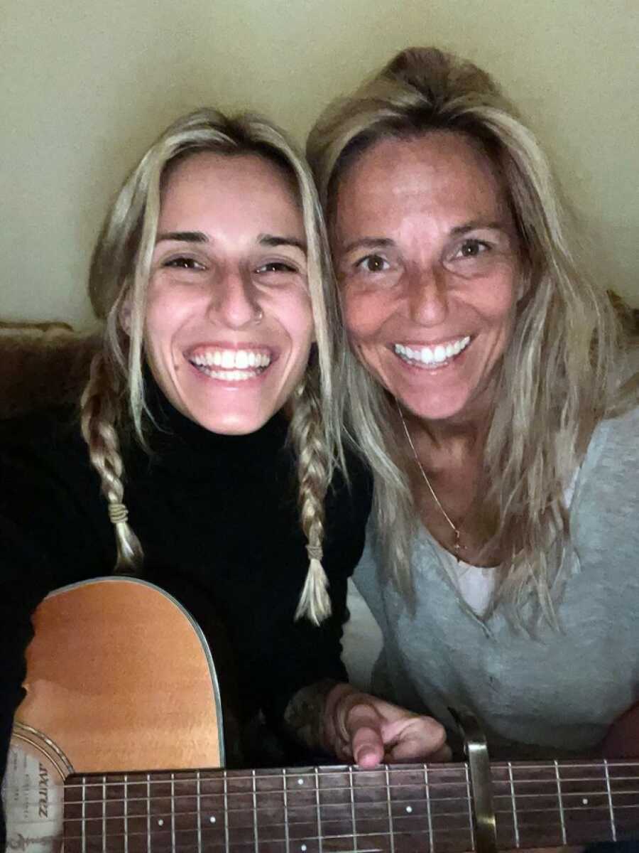 mom and daughter with a guitar excited for their sleep over