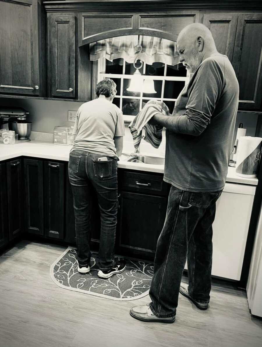 mom and dad doing the dishes as they always have done