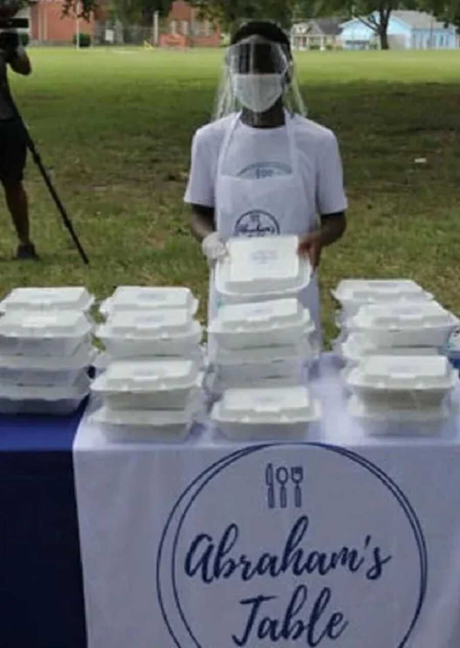 boy with his food to feed the homeless