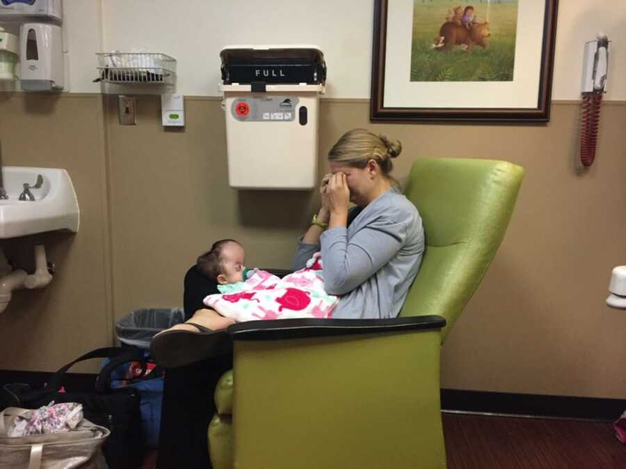 mom holding daughter while crying because of struggles