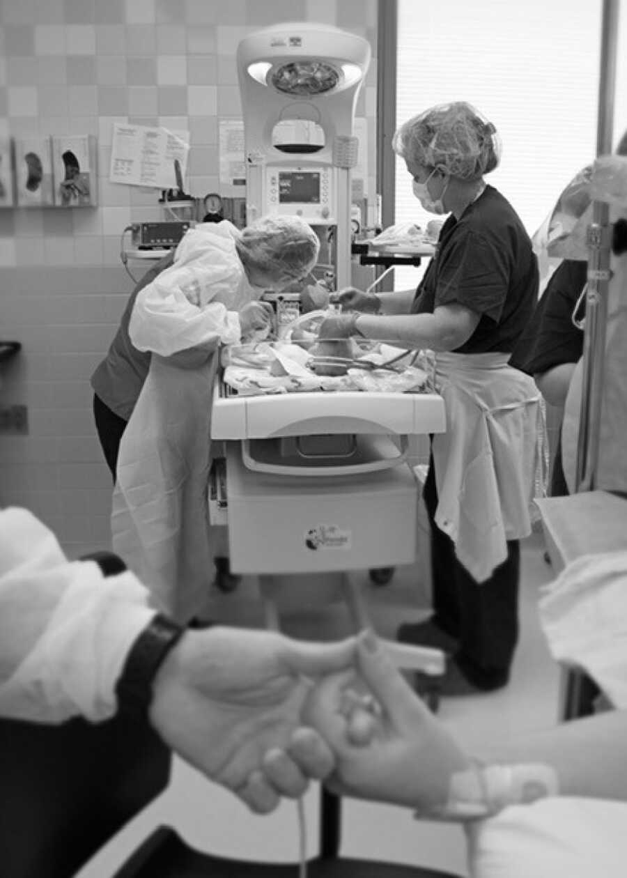 baby being taken care of by nurses after she was discovered with multiple problems