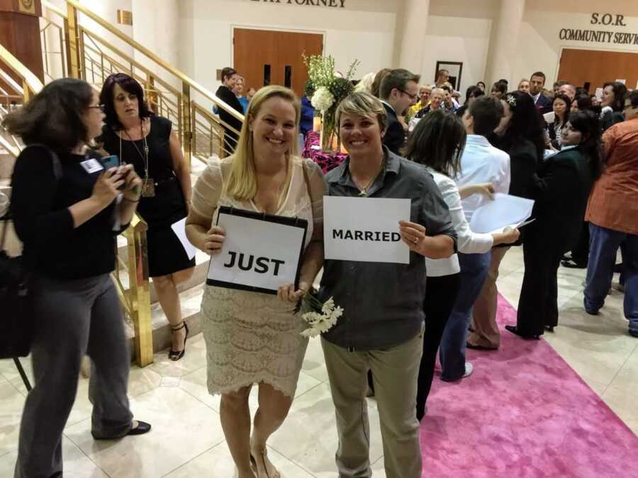LGBT women hold 'just married' sign in courthouse 