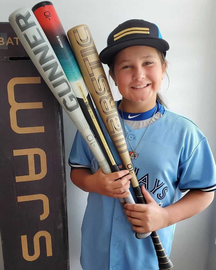 girl who was told she shouldn't play baseball with her baseball bats