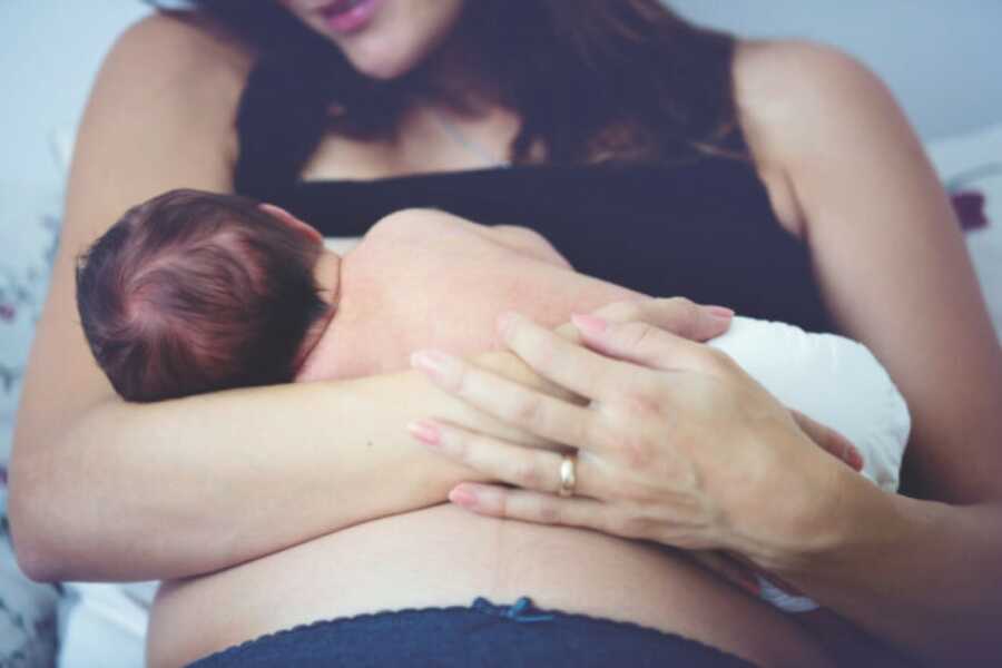 mom holding her baby right after birth