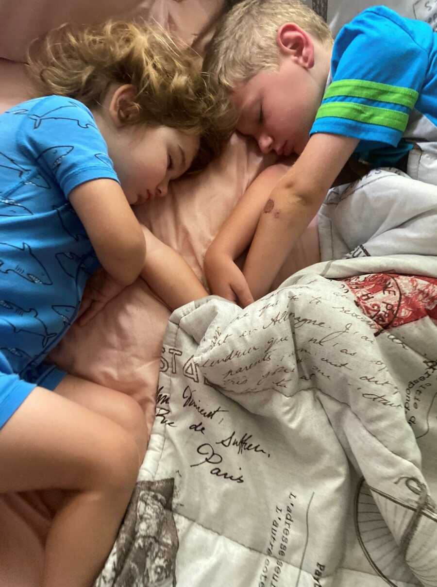 siblings in bed sleeping next to each other 