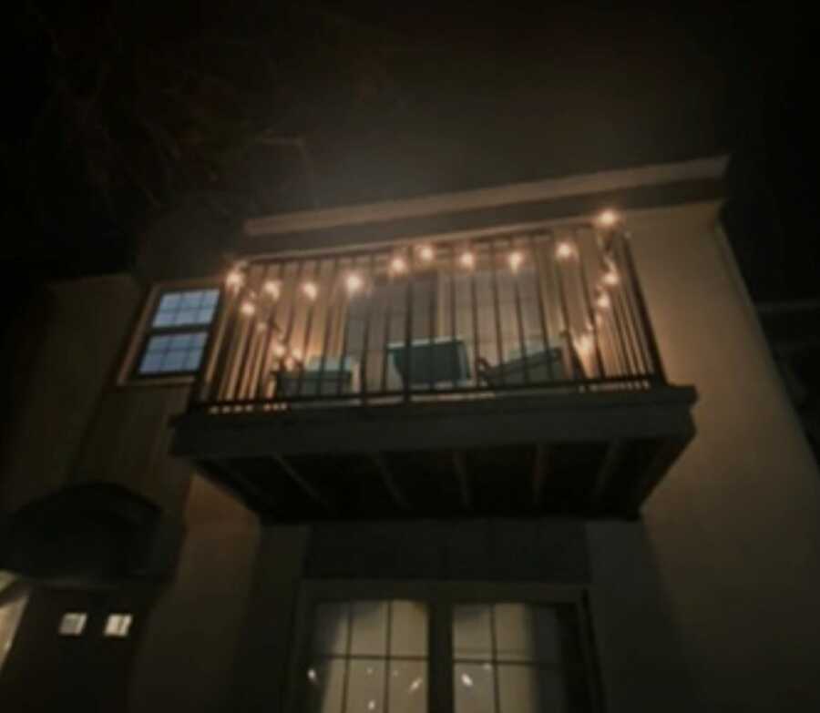 balcony with string lights in the night time