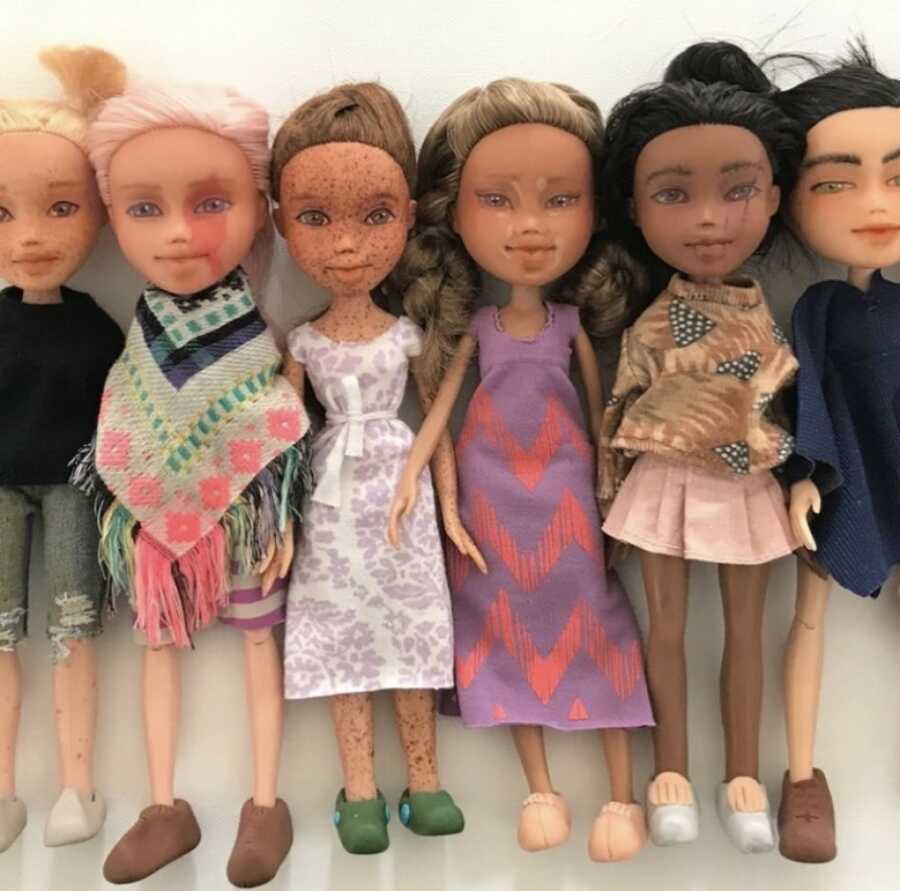 a group of dolls made by wife to show case their diversity