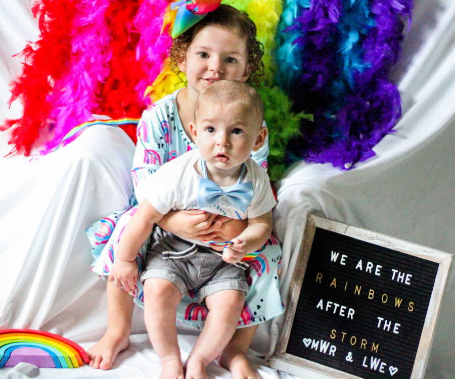 brother and sister being rainbow babies and posing