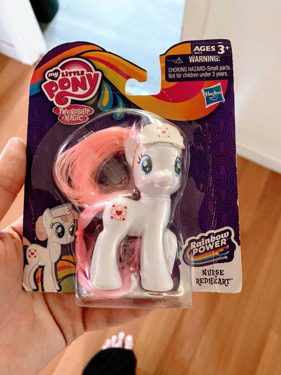 Nurse mom takes a photo of a nurse My Little Pony her co-parenting partner bought her