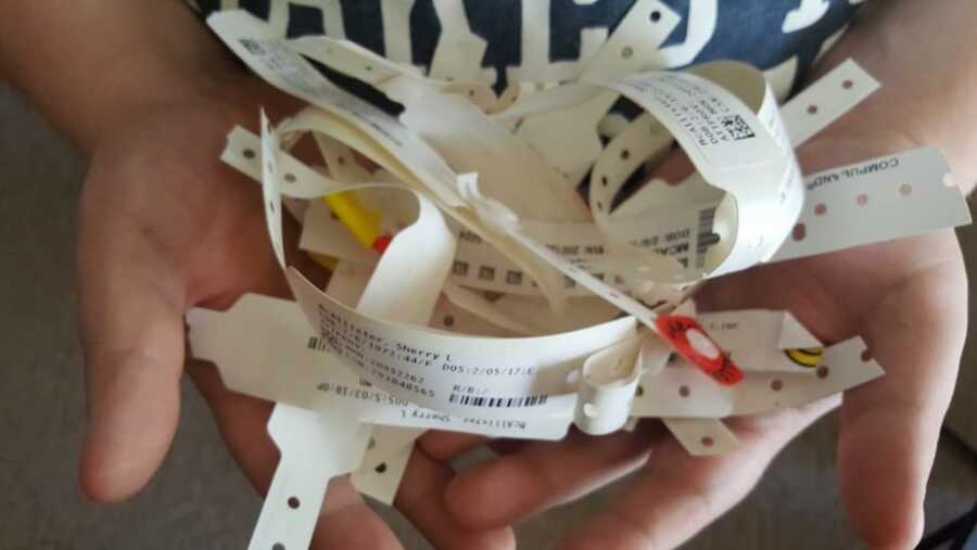 hospital bands of woman going to chemo therapy to battle cancer
