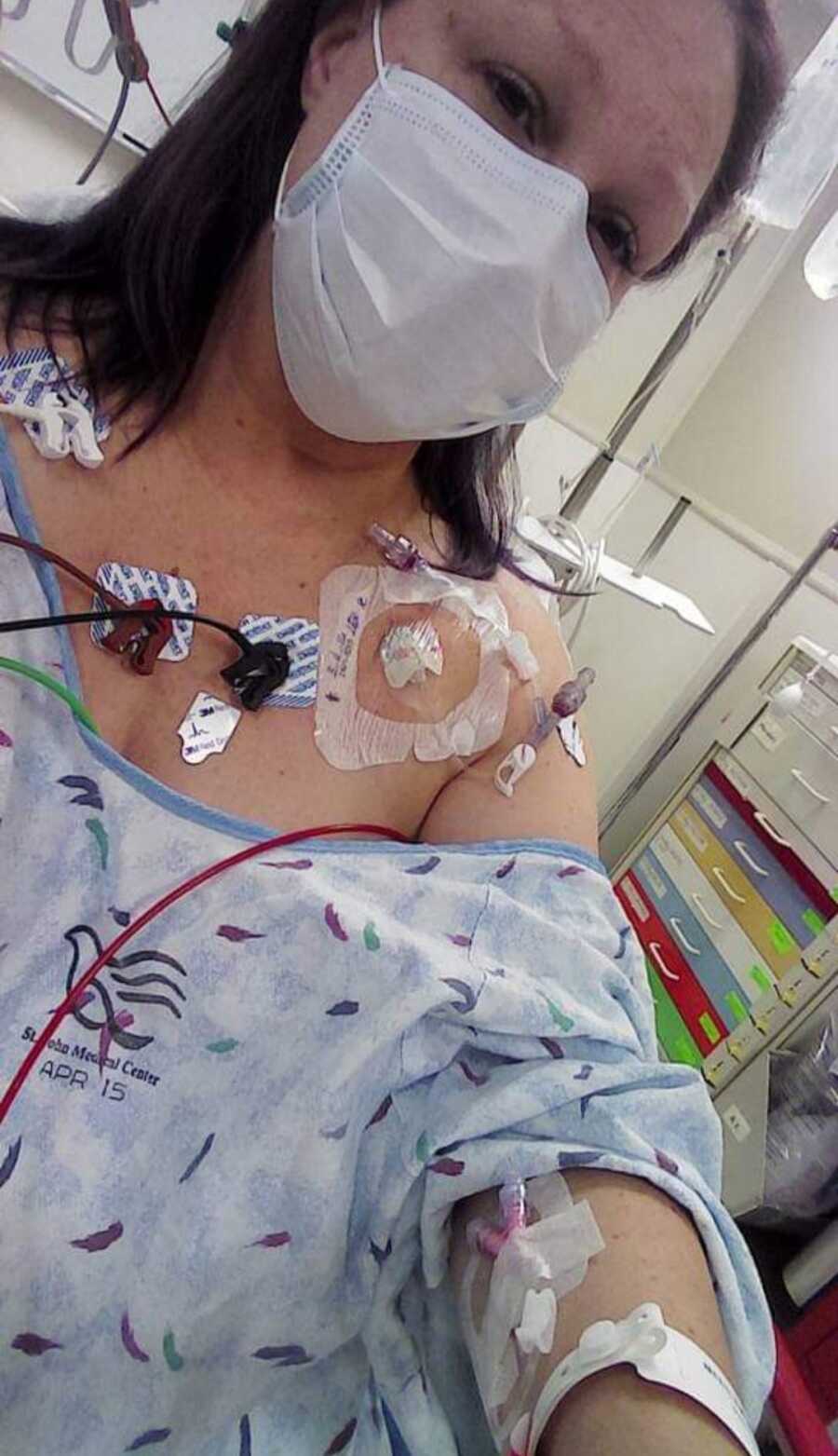 woman hooked up to hospital machines to see about her cancer
