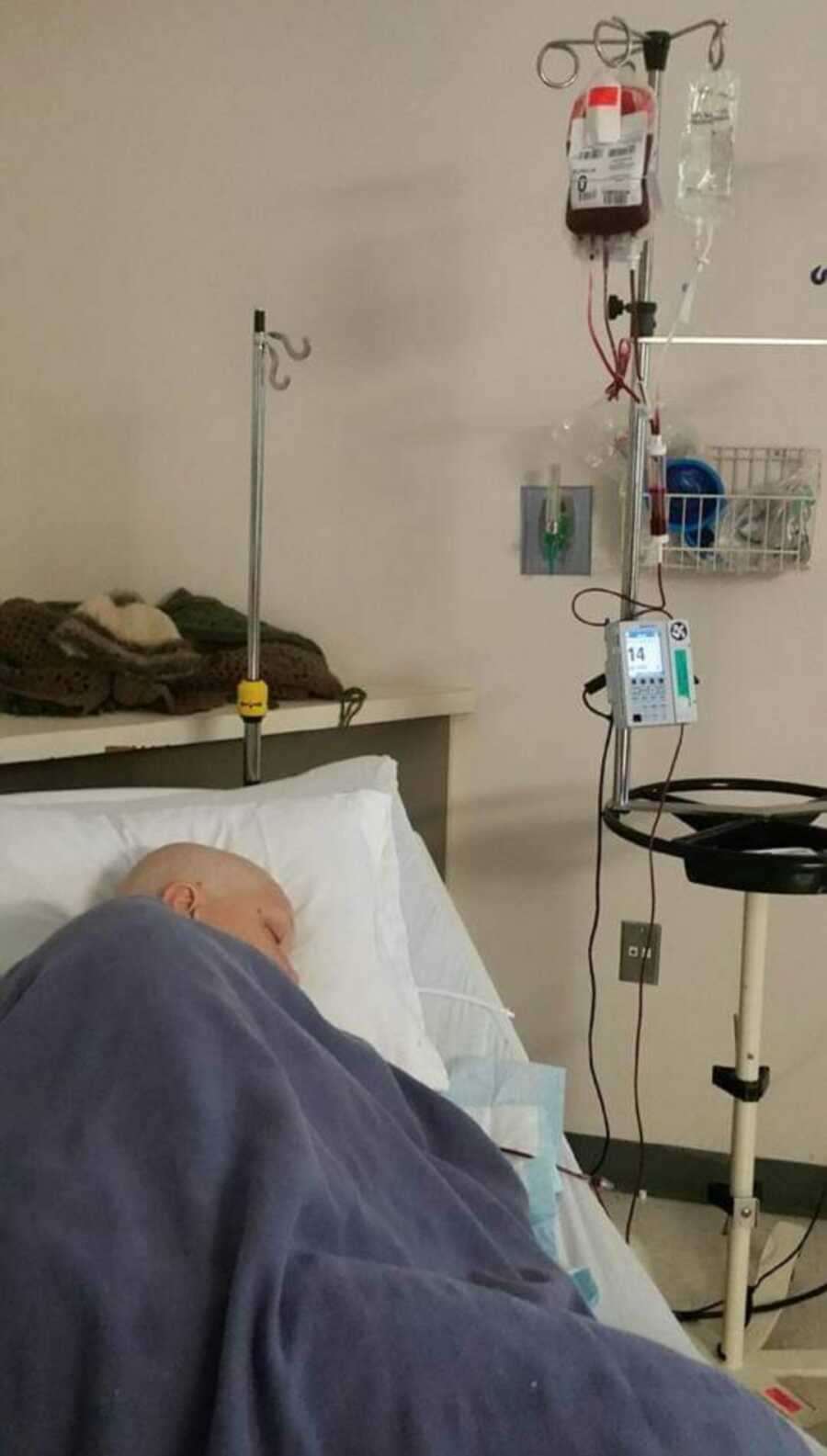 woman sleeping in the hospital bed while battling cancer