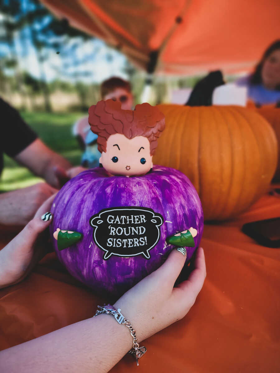 Young girl with Epilepsy makes a Hocus Pocus pumpkin at her Halloween-themed birthday party
