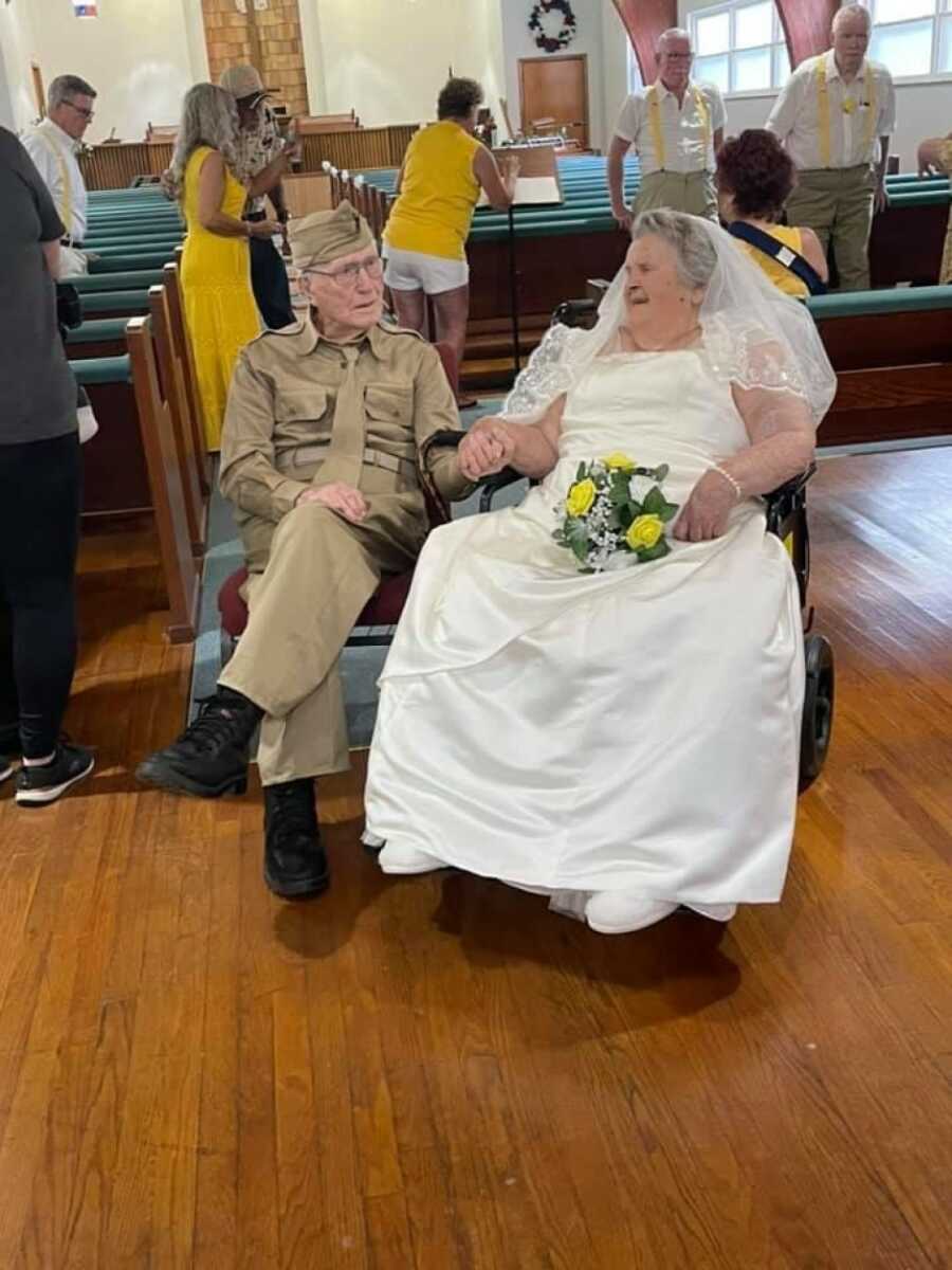 couple holding hands at their wedding