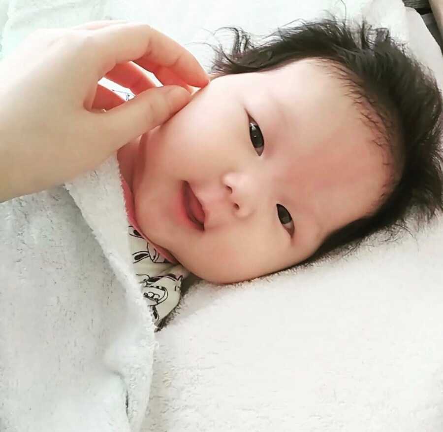 One of the first pictures of their baby girl received in their referral email.