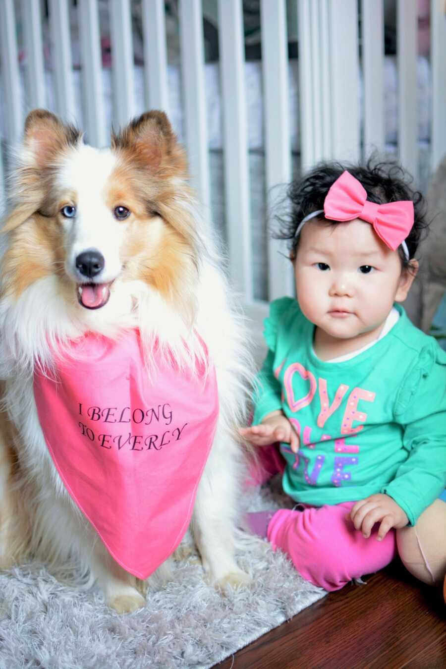 Everly sits with her new pup, Sadie. 