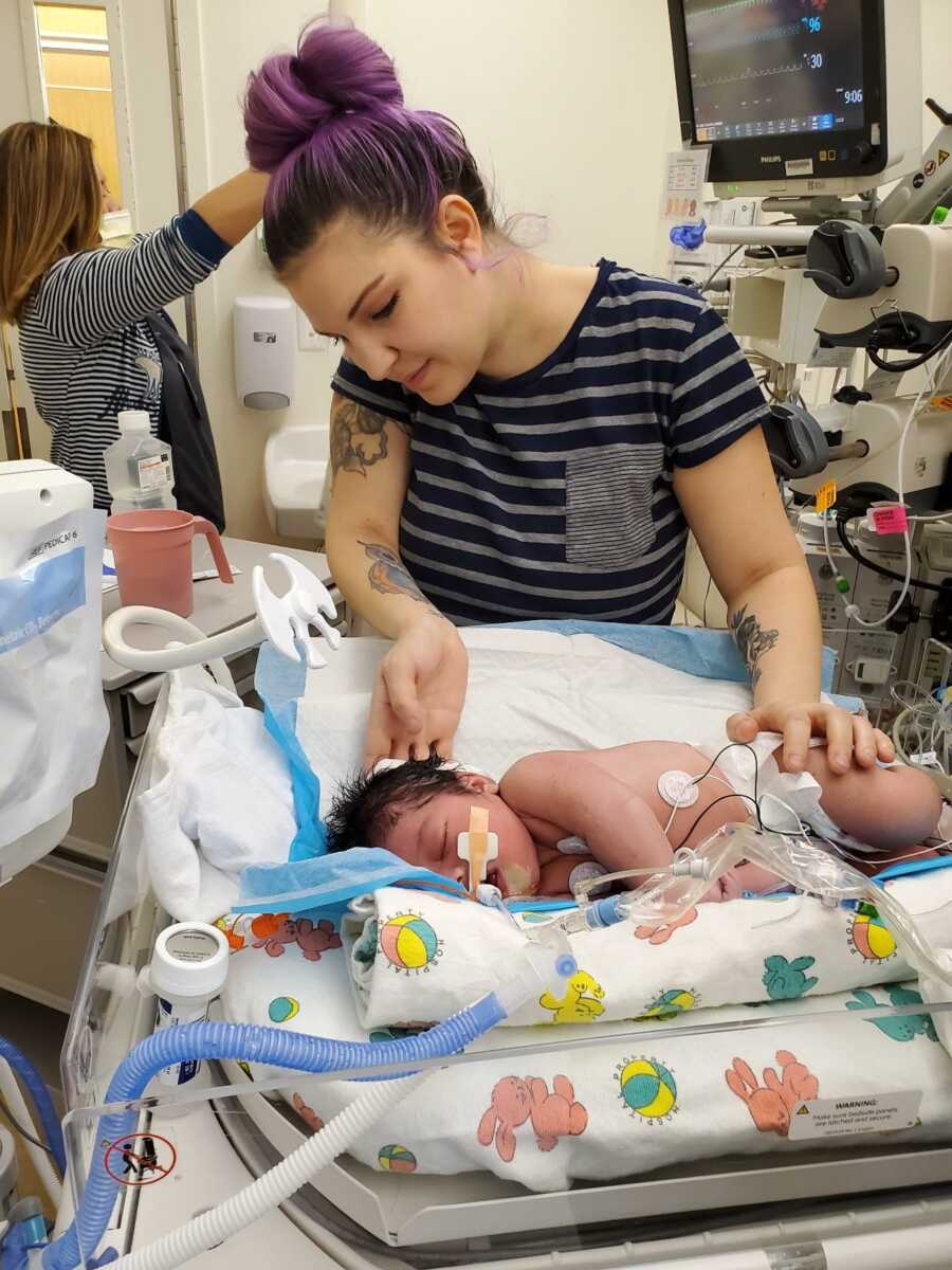 Breinne gives baby Sterling his first bath in the hospital.